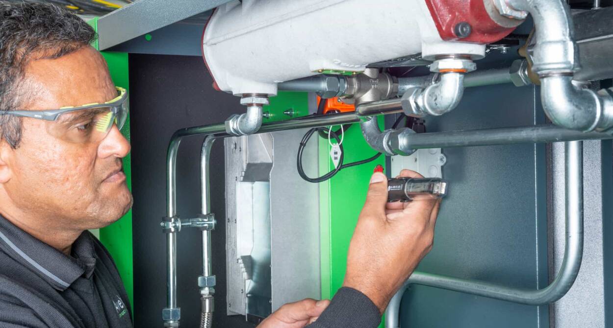 Avelair engineer servicing a compressor